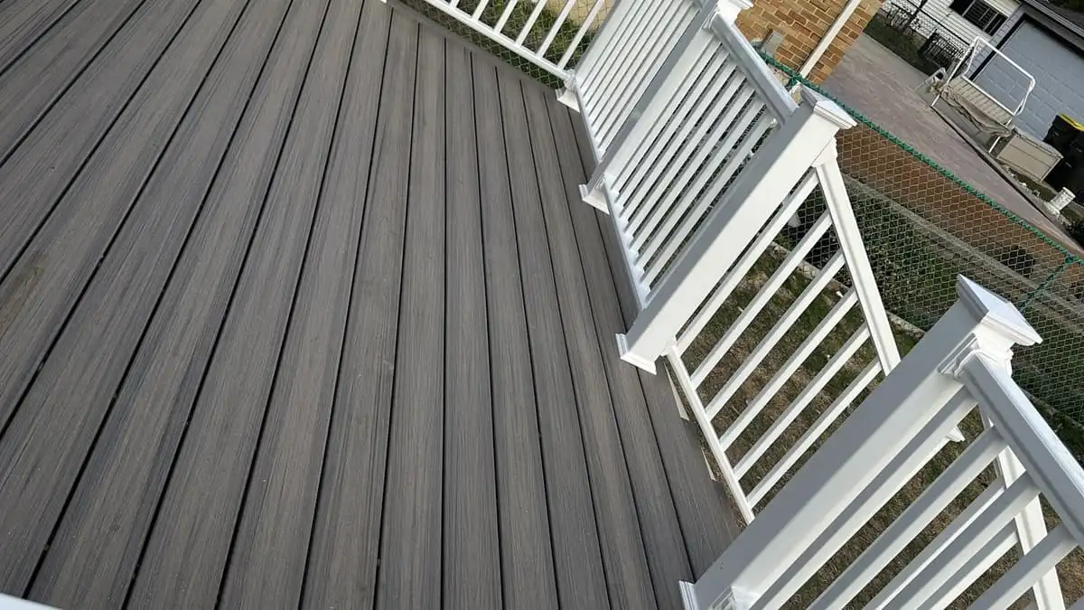 The same Roselle deck rebuilt in grey composite with white railings